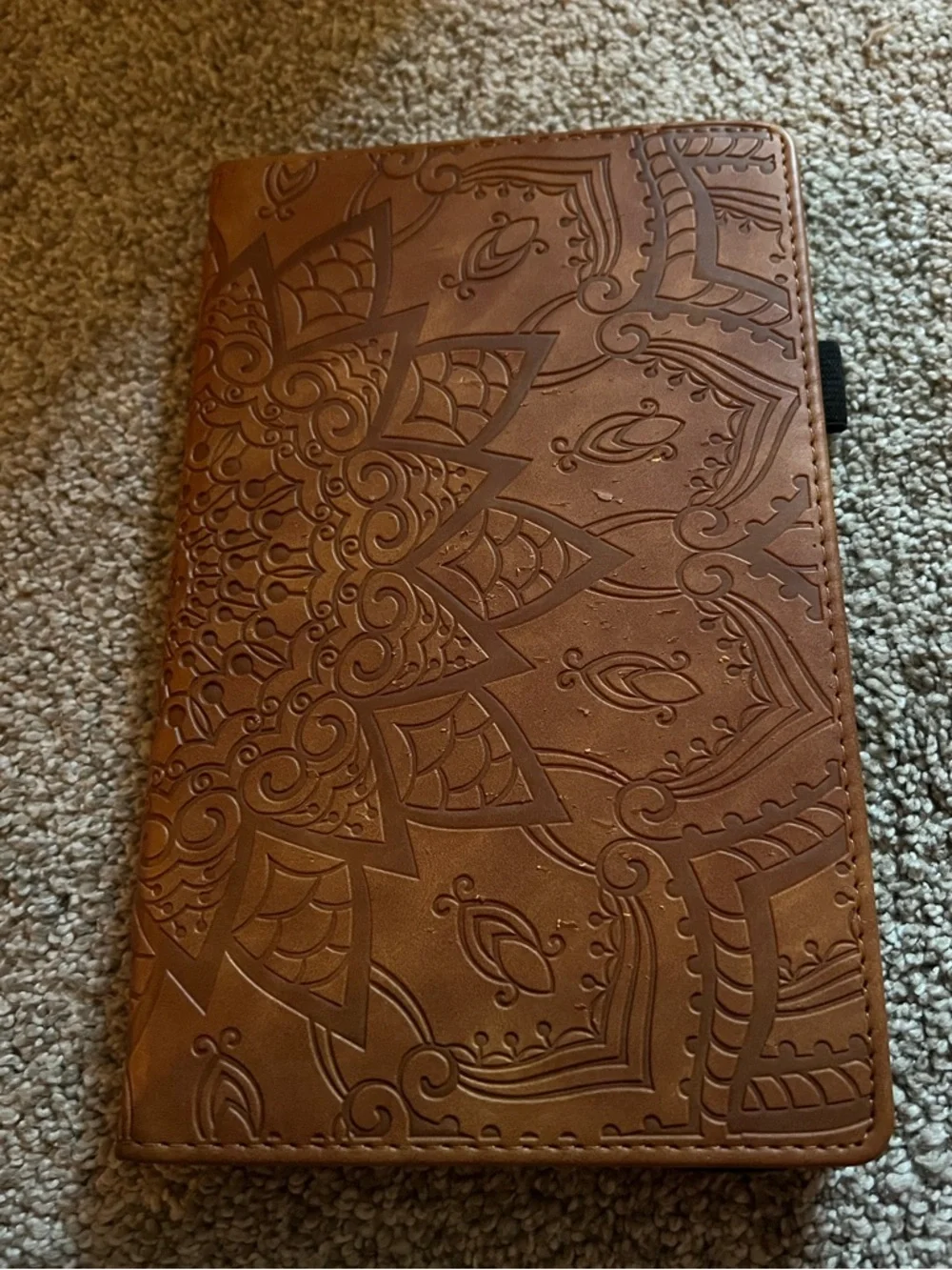 Tablet included with brown leather folio case